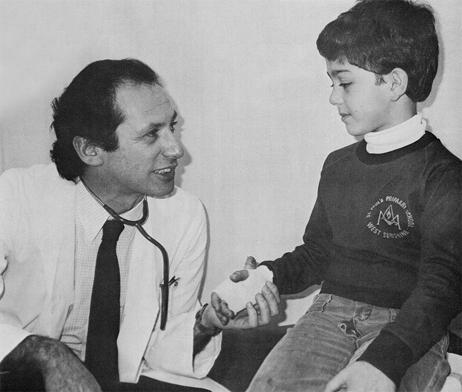 Director of Accident and Emergency Joe Epstein in 1983, getting to know one of the hospital’s smaller patients.