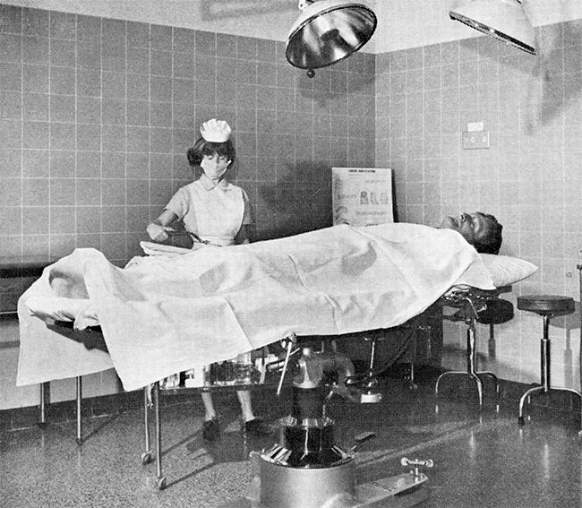 A nurse in 1965 prepares a patient for minor surgery in one of the two casualty theatres.