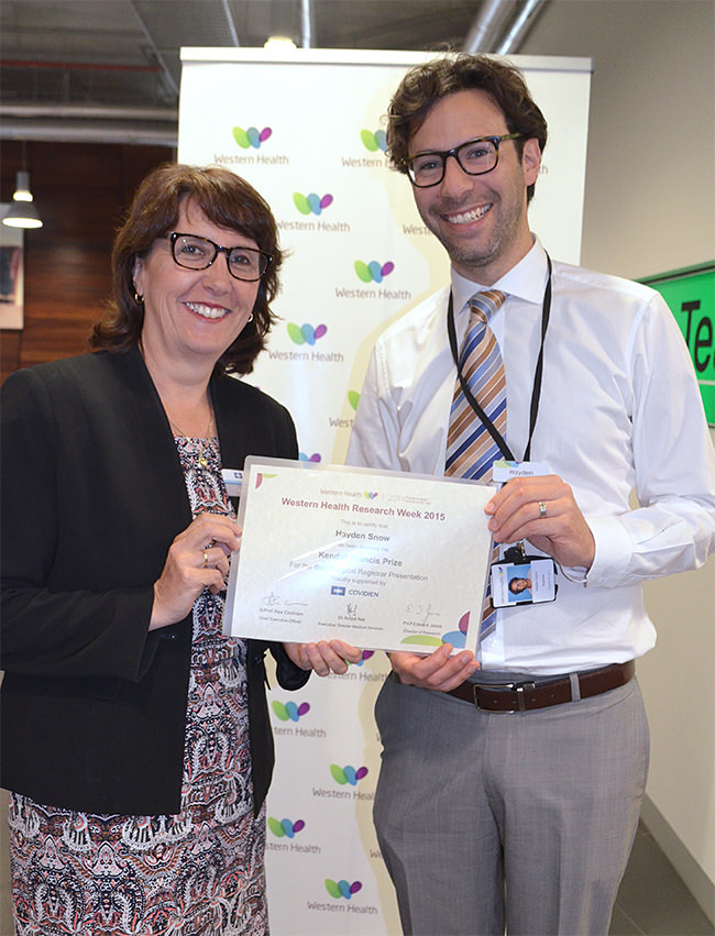 Hayden Snow receives the Kendall Francis Prize for the Best Surgical Registrar Presentation from Annette Tepper, of Covidien, the prize’s sponsor, at Western Health’s Research Week, 2015.